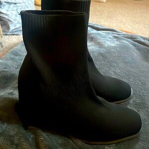 Black knit ankle boots.